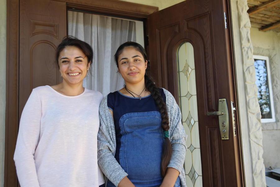In the village of Vulcanesti, Republic of Moldova in September 2018, Renata, 14 (right), stands with her older sister, Randunica, 24, who married at 17 and advises her younger sister to stay in school.