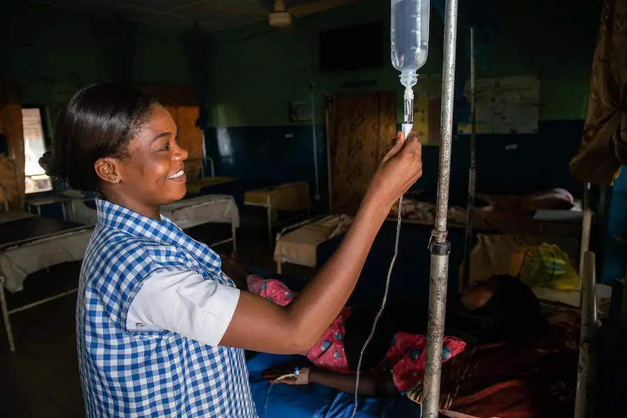 In October 2018, UNICEF-trained midwife Amilia Mathew inspects the IV drip of a mother who has just given birth in Yola, Nigeria. In October 2018, UNICEF-trained midwife Amilia Mathew inspects the IV drip of a mother who has just given birth in Yola, Nigeria.