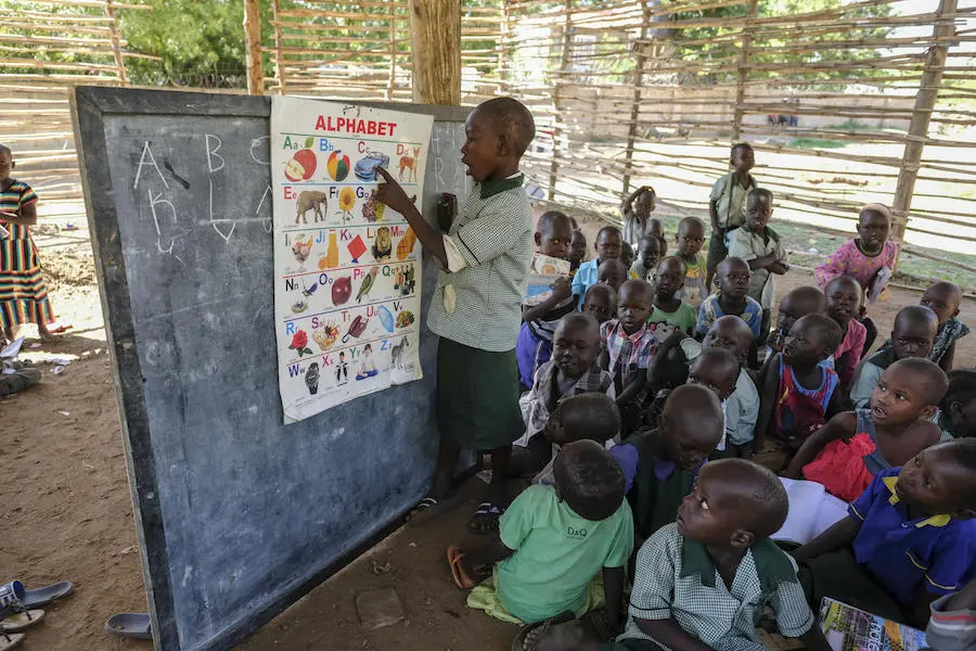 A child recites the English alphabet to a group of his 3- and 4-year-old peers in one of the classrooms of the picturesque Rock City School in Juba, South Sudan. A child recites the English alphabet to a group of his 3- and 4-year-old peers in one of the classrooms of the picturesque Rock City School in Juba, South Sudan.