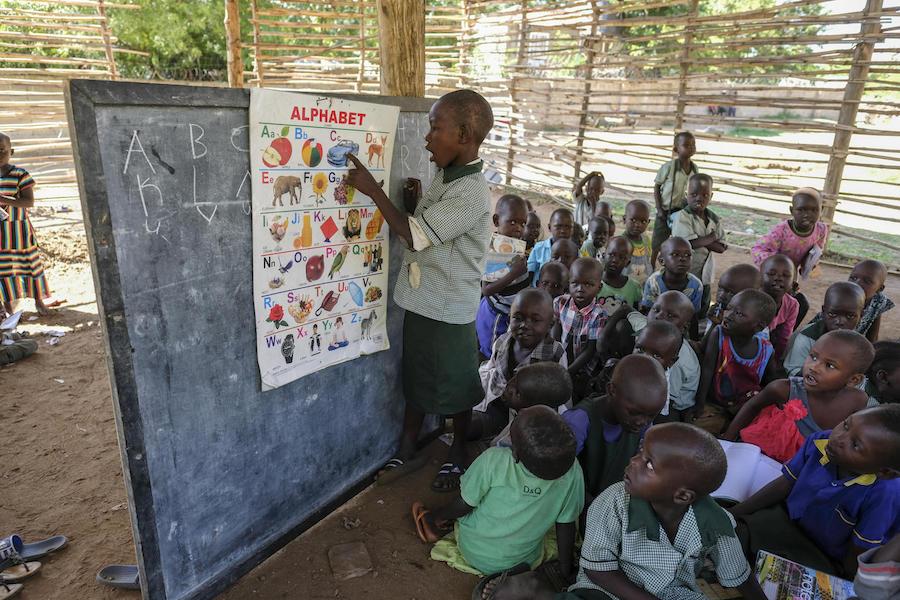 A child recites the English alphabet to a group of his 3- and 4-year-old peers in one of the classrooms of the picturesque Rock City School in Juba, South Sudan.