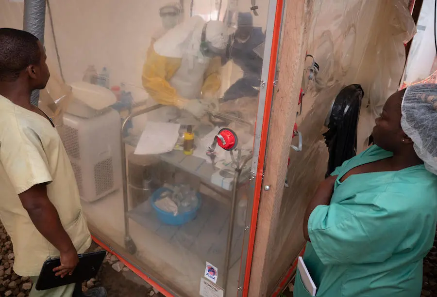 On 3 December 2018, an Ebola health care worker examines one week old Benedicte in an isolation tent at an Ebola treatment center in Beni, in the eastern DRC. Benedicte’s mother died of Ebola and she too is now infected. UNICEF, Democratic Republic of the Congo, DRC, Ebola