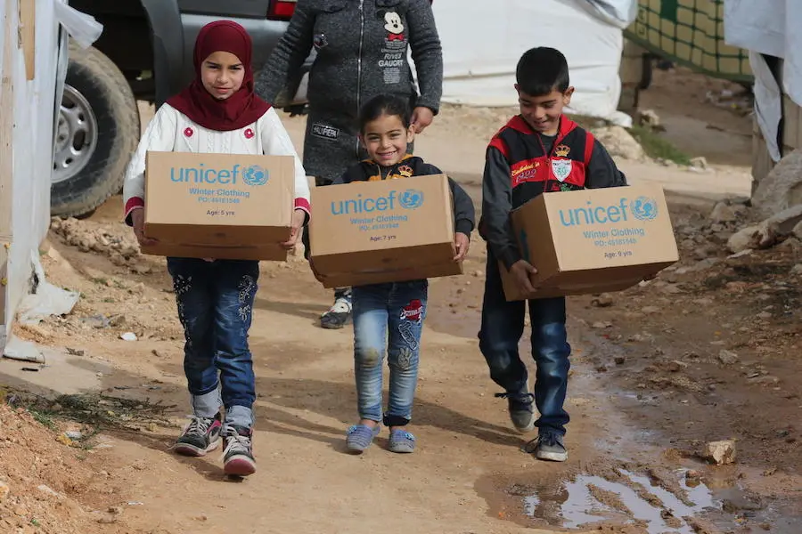 In December 2018, UNICEF distributed winter supplies to these young Syrian refugees bracing for winter in camps in the town of Ersal, East Lebanon, near the Syrian border. UNICEF, winter, Syrian refugees, Lebanon, humanitarian aid