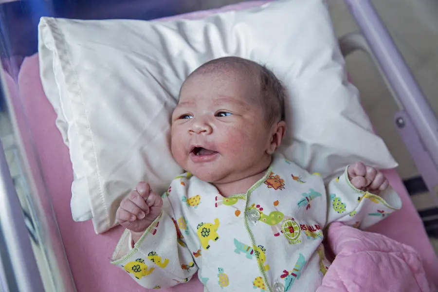 A newborn baby girl lies on a bed in the Ruman Awal Bros Hospital in Bekasi, Indonesia on January 1, 2019. UNICEF, Indonesia, New Year's baby, newborn