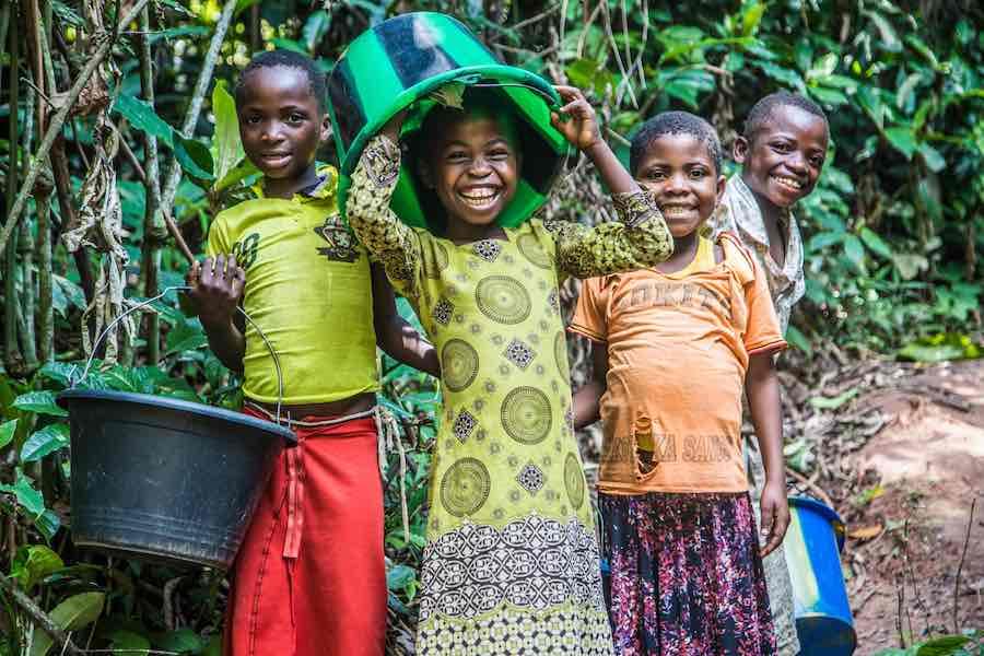 Children clown around while collecting water at a pumping and water distribution station near Kananga,Kasai-Occidental province, Democratic Republic of Congo (DRC), 25 October 2018. UNICEF built this particular station as part of its allotment of US$109 m