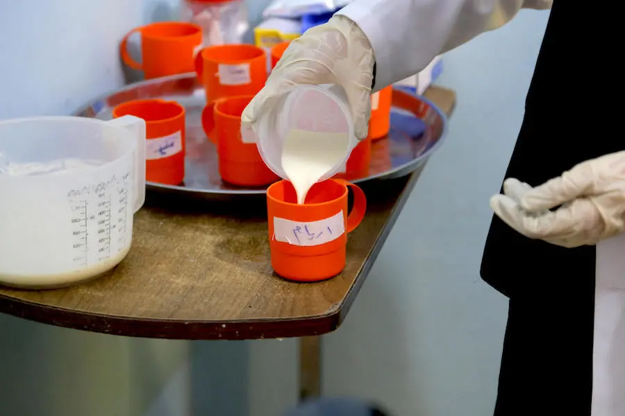 Dr. Waleed Ibrahim treats acutely malnourished children at the Al Qatea UNICEF-supported Therapeutic Feeding Center run by Tayba Foundation for Development in Yemen.