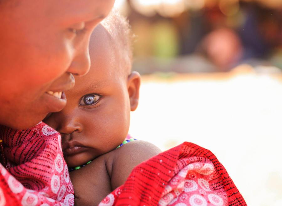 A mother of seven, 35-year-old Habiba Biyow Roba holds her 8-month-old daughter, Sumeya, at the UNICEF-supported Berak camp for internally displaced persons in Ethiopia's Oromia Region. 