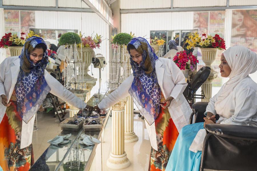 In February 2019 in Bangladesh, two interns in a UNICEF-supported vocational program at a beauty parlor in Ukhiya in Cox's Bazar district. 