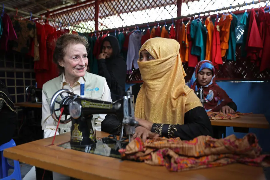 On 25 February 2019 in Bangladesh, UNICEF Executive Director Henriette H. Fore receives a sewing lesson from Rafika, 25, a Rohingya mother of 4 who is developing skills at the UNICEF-supported Safe Space for Women and Girls in a refugee camp in Bangladesh Rafika, 25, is learning to sew as part of a UNICEF-supported job skills program for Rohingya refugees in Cox's Bazar, Bangladesh.
