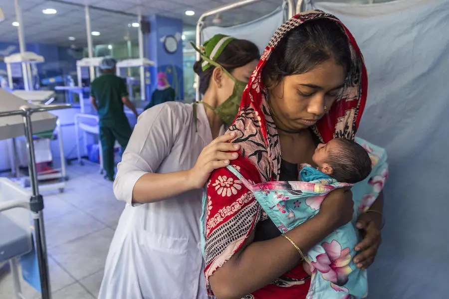 In February 2019, a newborn baby is tended by 19-year-old first-time mother Sharmin and a nurse at the UNICEF-supported Patuakhali Sadar Hospital in Cox's Bazar, Bangladesh. In February 2019, a newborn baby is tended by 19-year-old first-time mother Sharmin and a nurse at the UNICEF-supported Patuakhali Sadar Hospital in Cox's Bazar, Bangladesh.