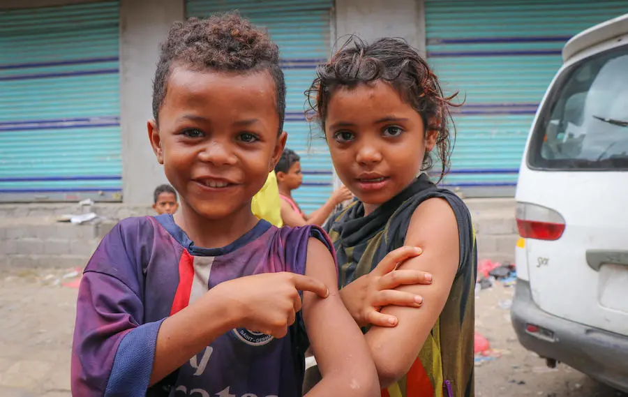 Children in Aden, Yemen proudly show off the spots on their arms where they were vaccinated during a mobile measles and rubella vaccination campaign backed by UNICEF in February 2019. Children in Aden, Yemen proudly show off the spots on their arms where they were vaccinated during a mobile measles and rubella vaccination campaign backed by UNICEF in February 2019.