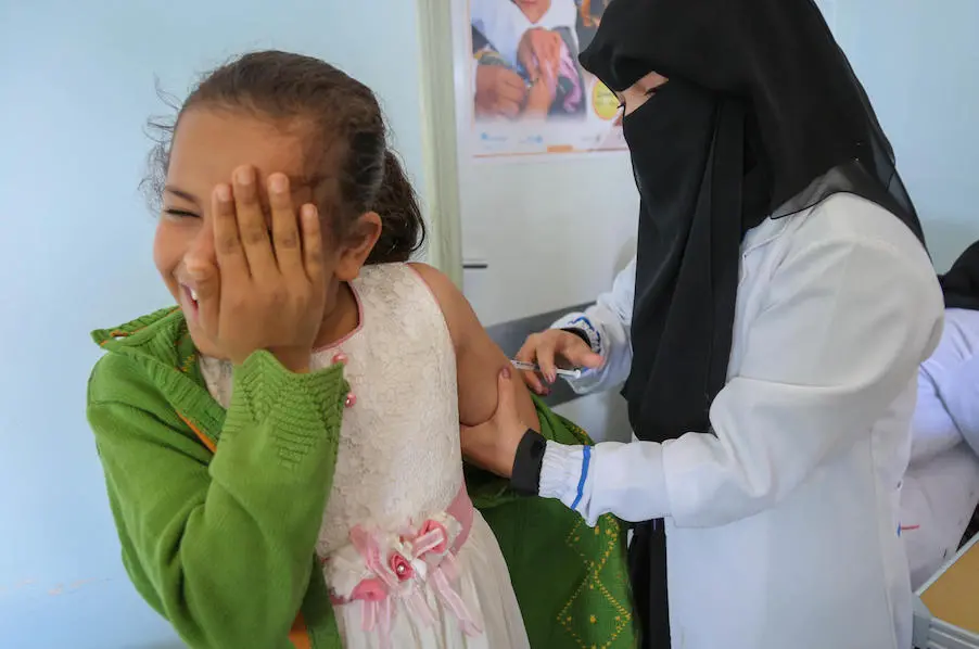A child braces for a Measles and Rubella vaccination given by a local health worker through a UNICEF-backed campaign in Bani Alhareth, Sana’a, Yemen on 9 February 2019. A child braces for a Measles and Rubella vaccination given by a local health worker through a UNICEF-backed campaign in Bani Alhareth, Sana’a, Yemen on 9 February 2019.