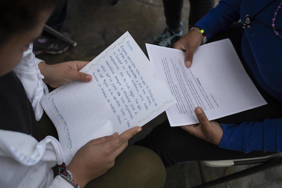 At a shelter for unaccompanied migrant adolescents in Tijuana, Mexico in February 2019, teenagers from Central America ready letters of support they received from Mexican teenagers.