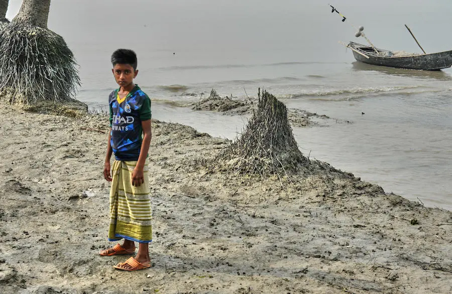 Maroof Hussein, 11, has vivid memories of the 2017 flood that killed his friend Iqbal in the village of Nizampur, Bangladesh on the fringe of the Bay of Bengal. Maroof Hussein, 11, has vivid memories of the 2017 flood that killed his friend Iqbal in the village of Nizampur, Bangladesh on the fringe of the Bay of Bengal.