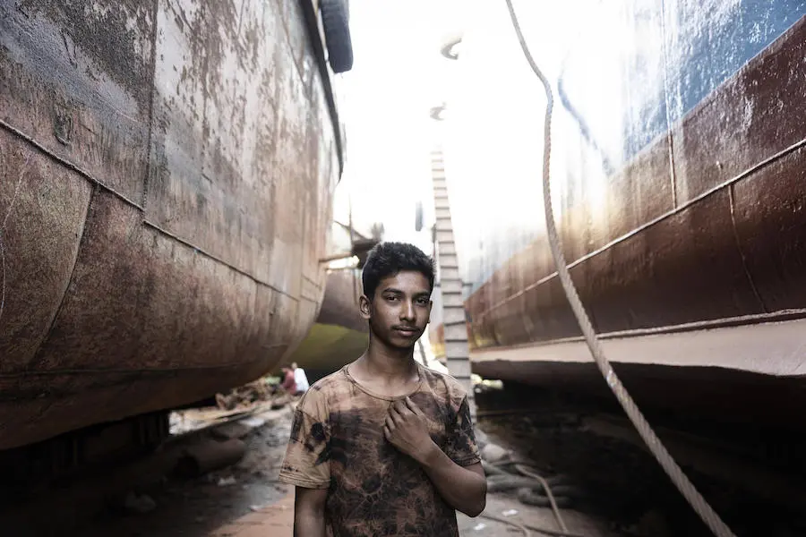 Sixteen-year-old Mohamed Shajib came to find work in Dhaka after flooding swept away his family's home. Sixteen-year-old Mohamed Shajib came to find work in Dhaka after flooding swept away his family's home.