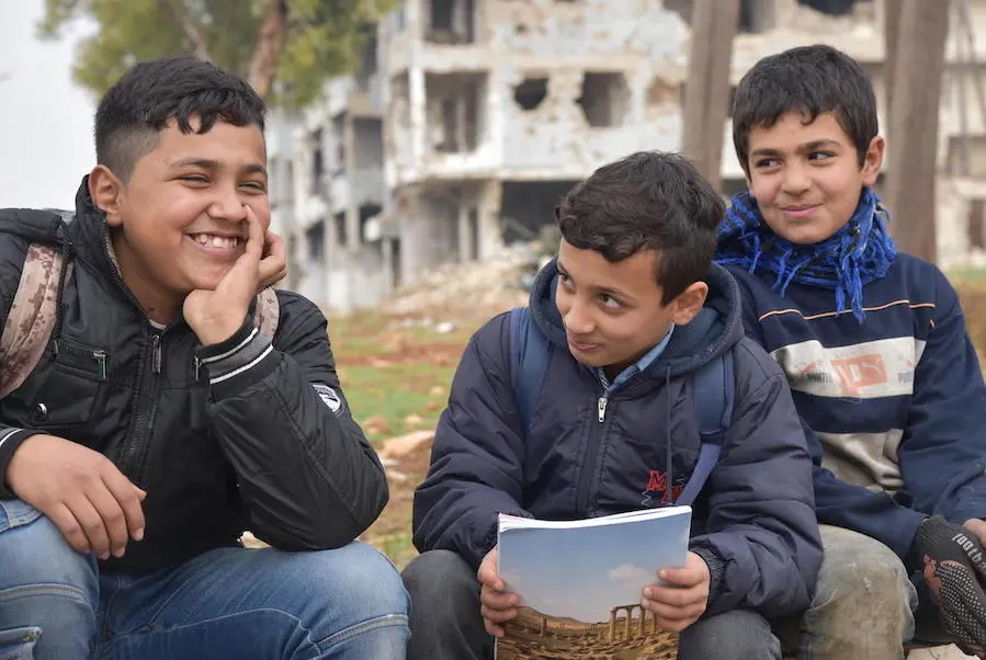 One out of three children in Syria are out of school. Hussein and Mohamed, left and center, go to school together in Aleppo, Syria, but their friend Mustafa, 12, does not. One out of three children in Syria are out of school. Hussein and Mohamed, left and center, go to school together in Aleppo, Syria, but their friend Mustafa, 12, does not.