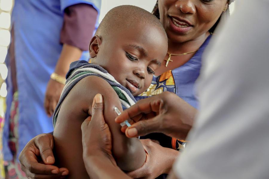 A brave boy receives his measles vaccine during a UNICEF-backed vaccination campaign in Impfondo, Democratic Republic of the Congo, in March 2019.