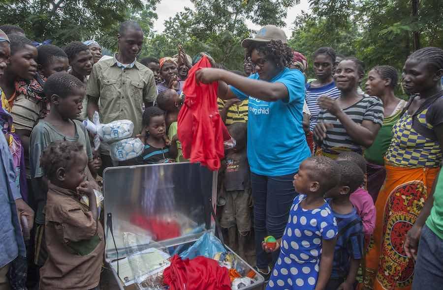 UNICEF Child Protection Officer Malla Mabona presents a Children’s Specialist Sports Kit to children of Nyachilenda Camp for people displaced by floods at Nyachilenda Primary School in the area of Traditional Authority Ndamera in Nsanje District in Southe
