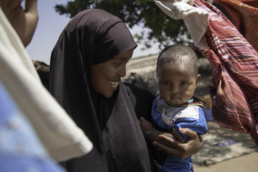 Hoodoo Said Hussein, 27, holds her 18-month-old son, Jimale, in Lasadawaco, Somaliland on March 5, 2019. Married when she was just 15, she dropped out of school after giving birth. She is now a student again, at a UNICEF-supported school. 