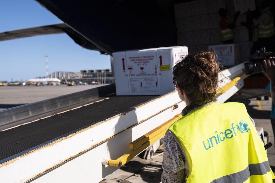 2 April 2019. A UNICEF employee watches as cholera vaccines are loaded from the cargo plane to a truck. A cargo plane arrived at Beira Airport with 900 000 cholera vaccines on board. These vaccines were provided by UNICEF and a vaccination campaign will s
