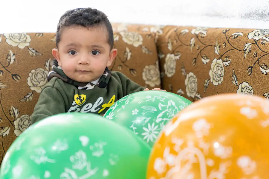 Baby Mohammad celebrated his first birthday at Azraq refugee camp in Jordan. He received his latest vaccination in one of the camp's UNICEF-supported health centers. Baby Mohammad celebrated his first birthday at Azraq refugee camp in Jordan. He received his latest vaccination in one of the camp's UNICEF-supported health centers.