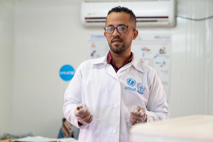 Children in this UNICEF-supported health clinic in Jordan's Azraq Refugee Camp receive vaccinations from Dr Almanti, the Ministry of Health coordinator.