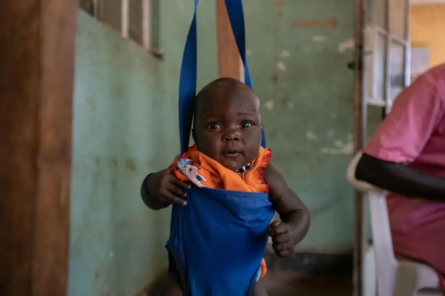 A baby is weighed before immunization at the UNICEF-supported Karenga HC IV in northern Uganda's Kaabong District on April 4, 2019. A baby is weighed before immunization at the UNICEF-supported Karenga HC IV in northern Uganda's Kaabong District on April 4, 2019.