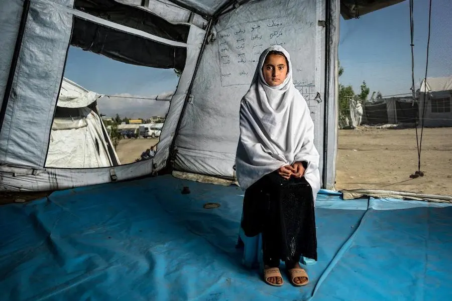 Kayenat's family fled intense fighting in the Shinwar district of Nangarhar province, in eastern Afghanistan. Now she has resumed her education at a UNICEF temporary learning space. Kayenat's family fled intense fighting in the Shinwar district of Nangarhar province, in eastern Afghanistan. Now she has resumed her education at a UNICEF temporary learning space.