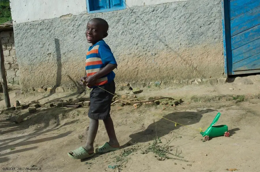 Five-year-old Schadrack plays with a homemade truck outside his family's rural home in Rutsiro District, Rwanda in May 2017.