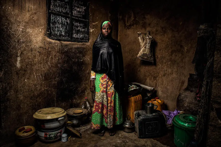 Bintu, 13, stands in her home in Banki, northeast Nigeria, on May 1, 2019. Her home village was attacked four years ago and her school was destroyed. Bintu, 13, stands in her home in Banki, northeast Nigeria, on May 1, 2019. Her home village was attacked four years ago and her school was destroyed.