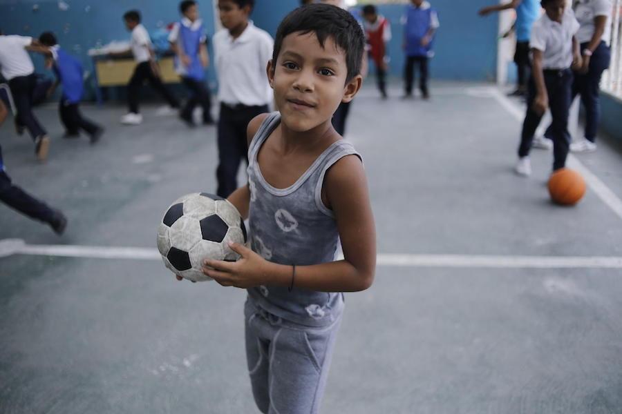 UNICEF provides recreational and educational kits for children who attend El Carmen, a school in Barrio Union, Petare, on the outskirts of Caracas. 