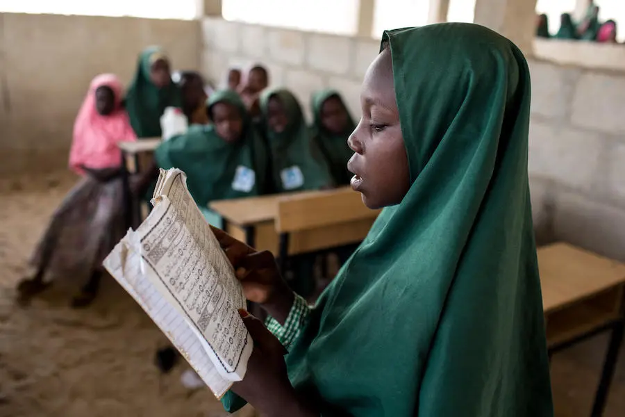 Zara, 11, reads to her Grade 3 class at Dala Shuwari Integrated Quranic School in Maiduguri, the capital of Borno state in northeast Nigeria. Zara, 11, reads to her Grade 3 class at Dala Shuwari Integrated Quranic School in Maiduguri, the capital of Borno state in northeast Nigeria.
