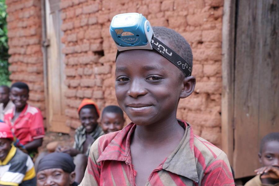 In May 2019, 9-year-old Nadia wears the solar lamp her family bought through Project Lumière, a UNICEF-supported venture that brings solar power to Burundi.