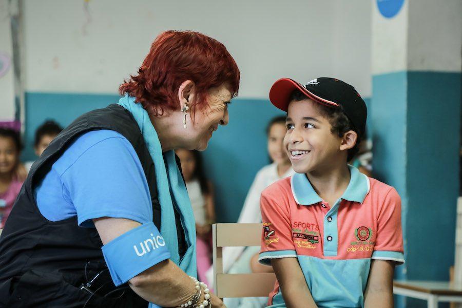 UNICEF Worker Laughing with Child