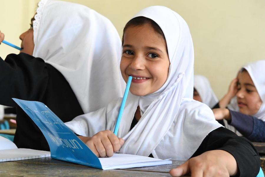 Students at the Bibi Amina Girls High School in Panjshir, a province in northern Afghanistan, are excited to receive their new UNICEF school kits in August 2019.