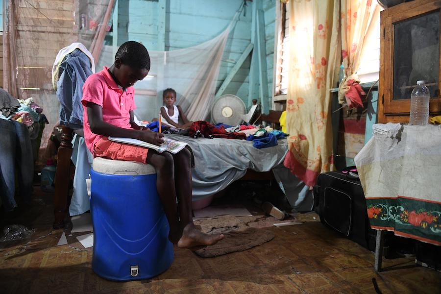 Joel tries to study at home in Jamaica while his school is closed due to the COVID-19 pandemic.