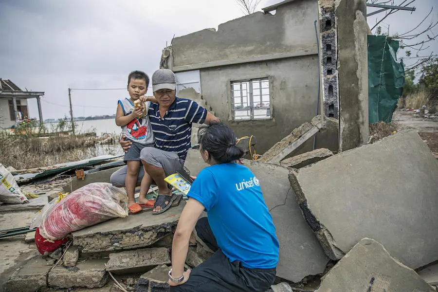Man and Child on Building Rubble
