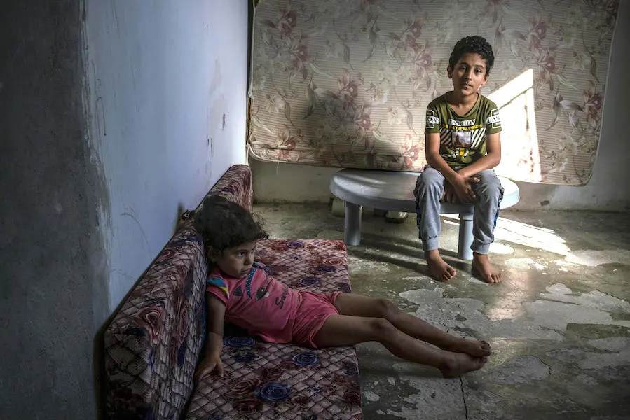 Hanin, 4 (left), and Ahmad, 10, and their family, Syrian refugees living in Amman, Jordan, face another frigid winter. UNICEF's emergency cash assistance program and winter clothing kits will help them survive. Hanin, 4 (left), and Ahmad, 10, and their family, Syrian refugees living in Amman, Jordan, face another frigid winter. UNICEF's emergency cash assistance program and winter clothing kits will help them survive.
