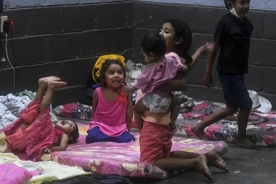 hildren play in a temporary shelter during heavy winds caused by Eta Hurricane at the Polideportivo in Tela, 300 km northern Tegucigalpa, on November 3, 2020. hildren play in a temporary shelter during heavy winds caused by Eta Hurricane at the Polideportivo in Tela, 300 km northern Tegucigalpa, on November 3, 2020.
