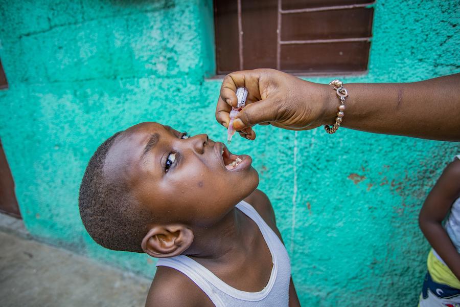 4-year-old Daniel receives polio drops as part of UNICEF-supported immunization campaign in Kinshasa, DR Congo.