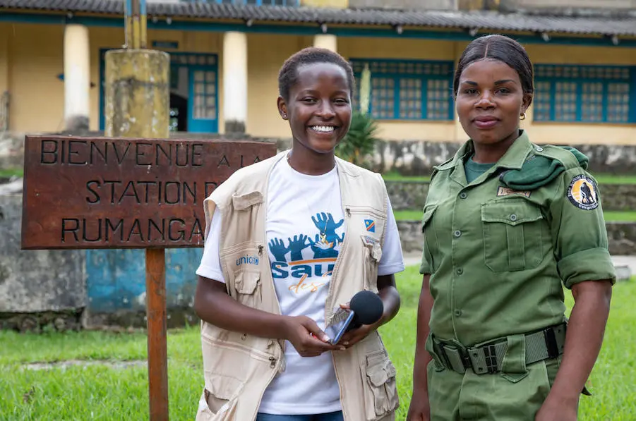 In Virunga National Park, DRC, 16-year-old UNICEF Child Reporter Ketsia, left, spoke with Aline, an eco-guard who monitors and protects the park. In Virunga National Park, DRC, 16-year-old UNICEF Child Reporter Ketsia, left, spoke with Aline, an eco-guard who monitors and protects the park.
