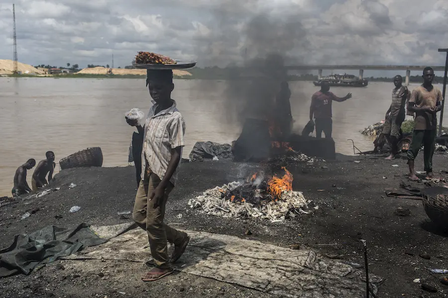 People Standing Around Fire