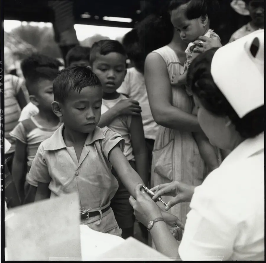 A boy receives the anti-tuberculosis vaccine during a UNICEF-supported campaign in The Philippines in 1952. A boy receives the anti-tuberculosis vaccine during a UNICEF-supported campaign in The Philippines in 1952.