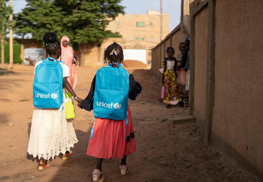 Two sisters in Niamey, Niger return to their school after a long absence due to a COVID-19 shutdown. 