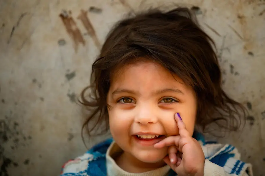 In Lahore, Pakistan in January 2021, a 3-year-old girl shows her finger, marked in purple to indicate she has been vaccinated against polio. In Lahore, Pakistan in January 2021, a 3-year-old girl shows her finger, marked in purple to indicate she has been vaccinated against polio.