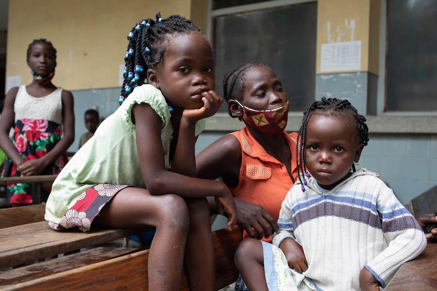 Over 600 of those displaced by Cyclone Eloise — including Joana Babasse, center, and her children, Amilia, 7, left, and Anguista, 4 — have taken shelter at the Samora Machel school in Beira, where they are sleeping in classrooms.