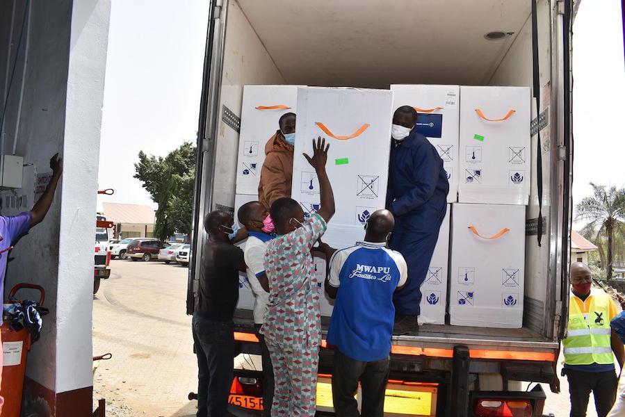 On March 2, 2021, workers offload a shipment containing 3.94 million doses of COVID-19 vaccines procured by the COVAX Facility at the Nnamdi Azikiwe International Airport in Abuja, Nigeria.
