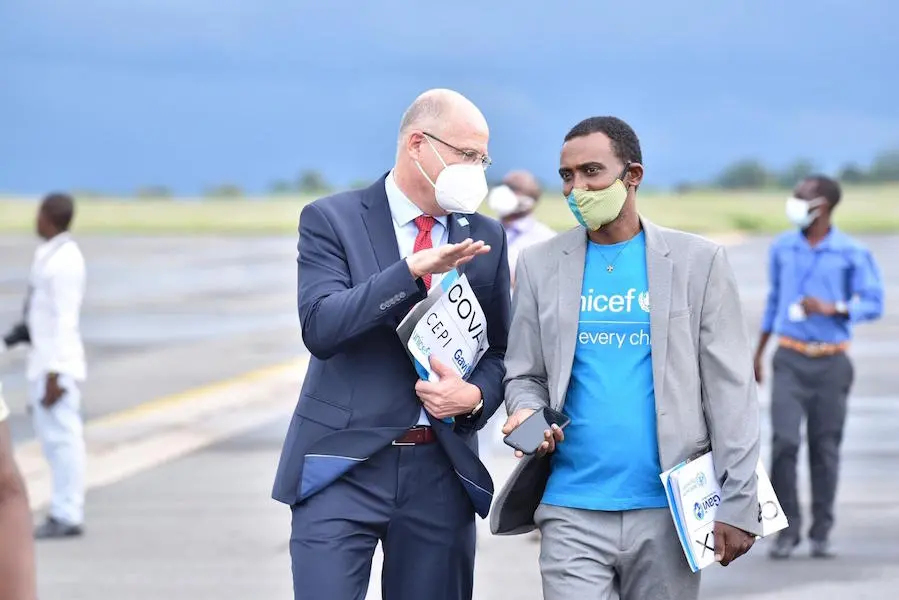 Two Men Talking with Face Masks On