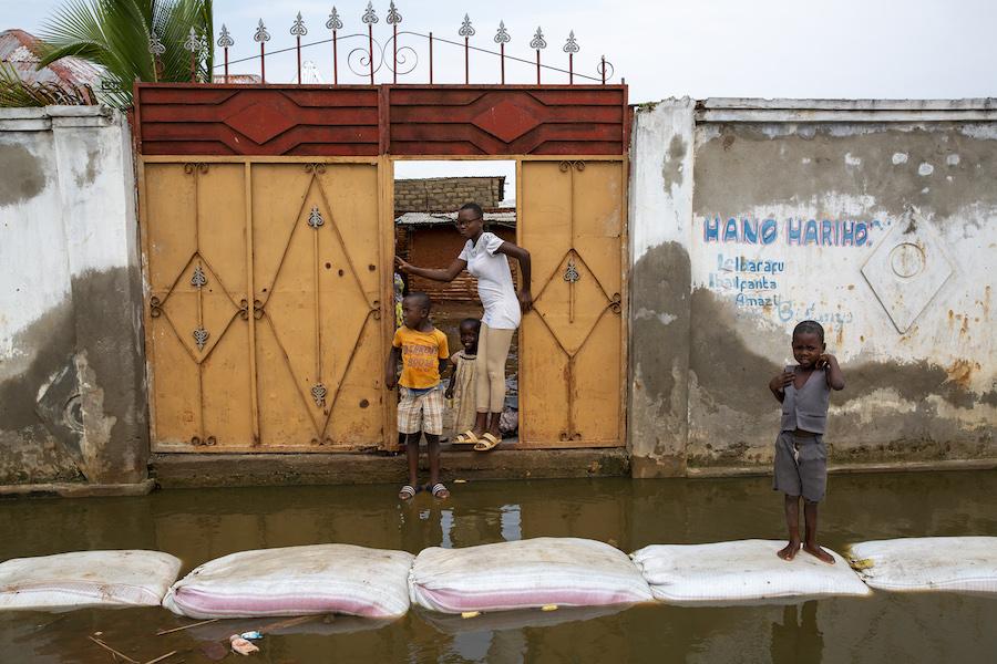 Residents negotiate the floodwaters in Gatumba, located near Bujumbura in Burundi.