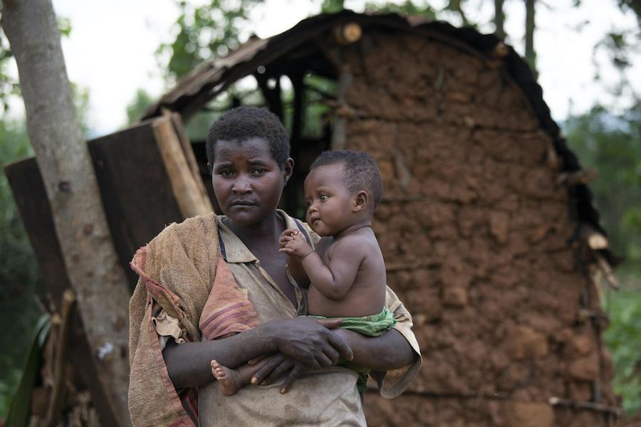 Janviere, 30, holds her nine-month-old daughter Estella near their shelter in Kibande, Burundi.