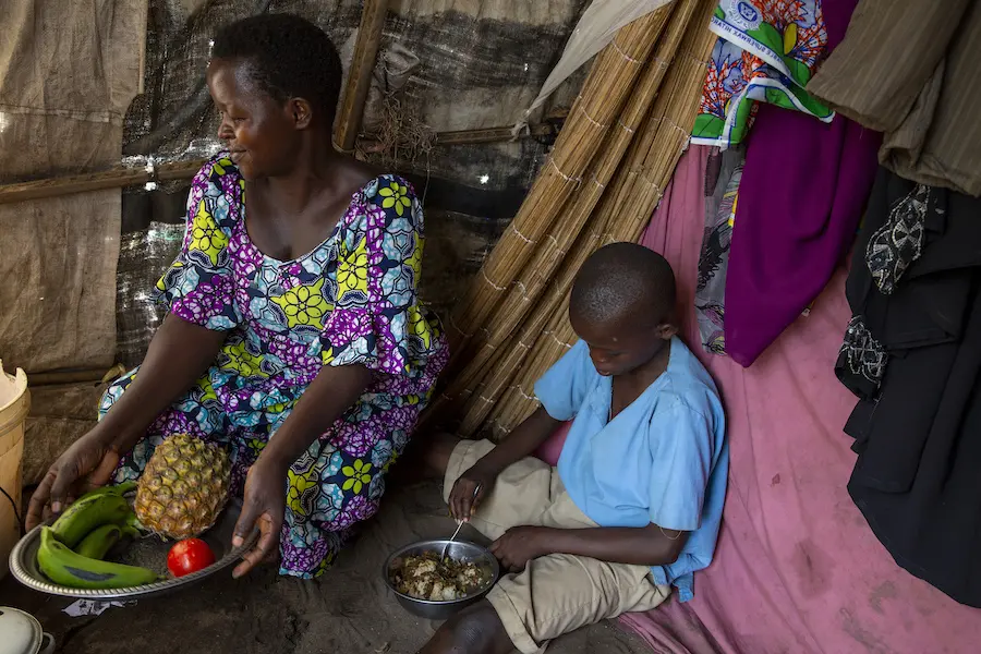 Jeannette, a seamstress, and her son have been staying at a displacement camp in Gatumba, Burundi since floodwaters destroyed their home. Jeannette, a seamstress, and her son have been staying at a displacement camp in Gatumba, Burundi since floodwaters destroyed their home.